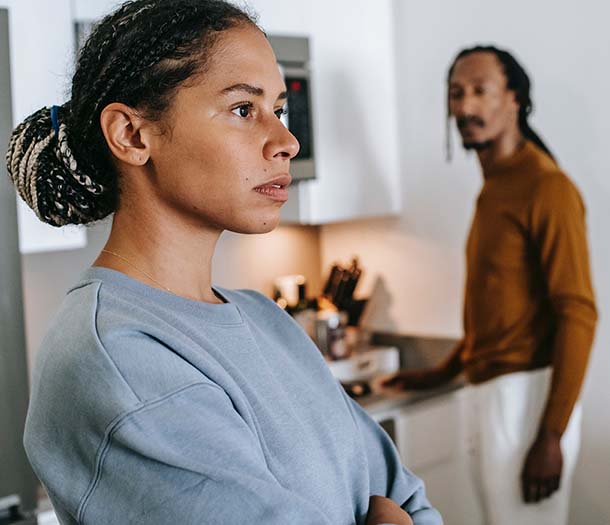 A couple arguing to each other at home