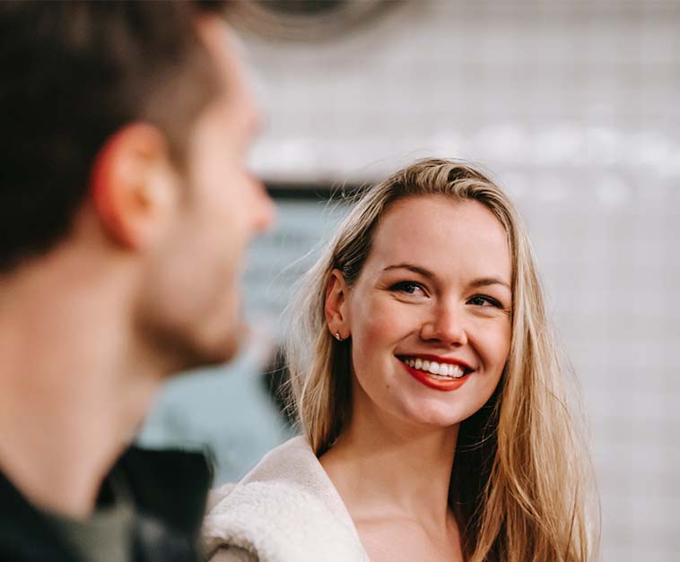 A happy woman with anonymous man