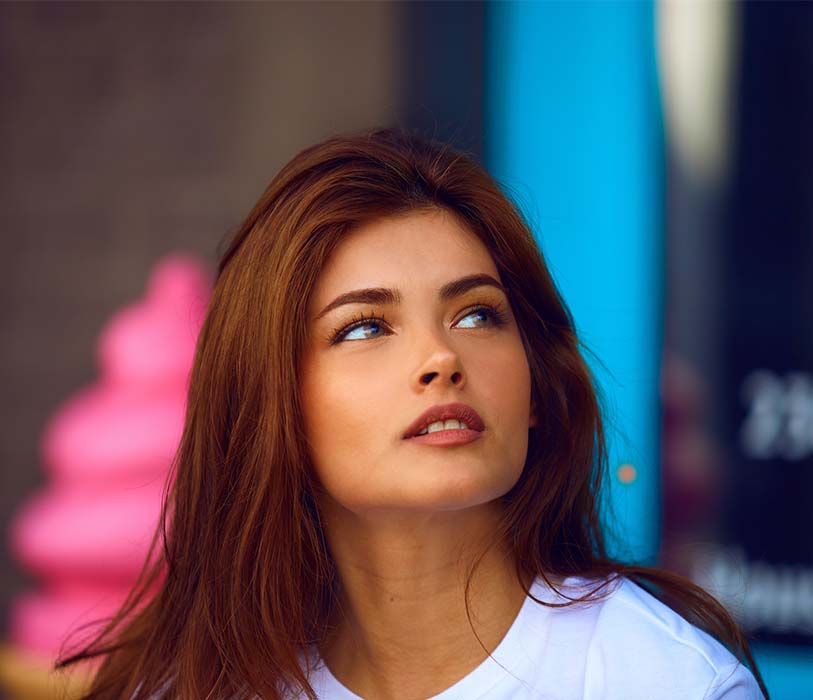 A selective photography of a woman in white crew-neck shirt