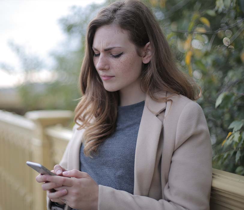 A woman in using a smartphone