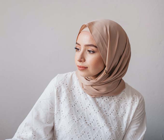 A woman wearing hijab looking away
