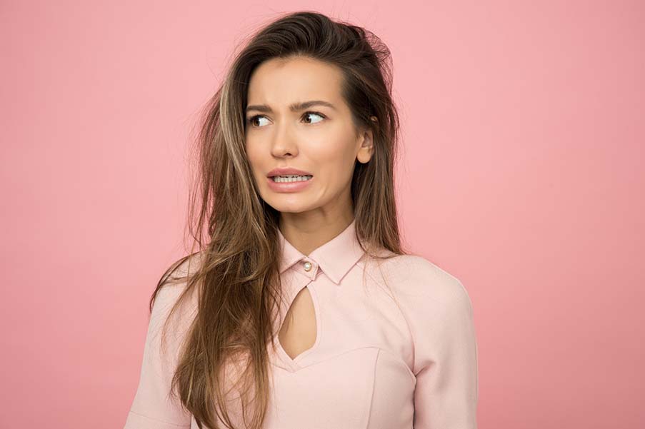 A woman wearing pink top