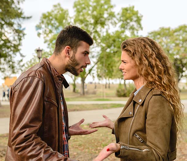 man and woman wearing brown leather jackets