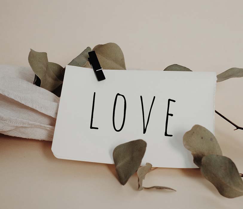 word love written on white paper